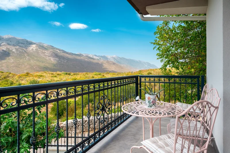 Balcony table and chairs overlooking the Biokovo mountains