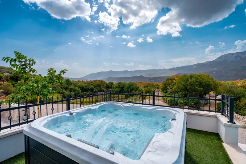 Bubbling outdoor Jacuzzi with an open mountain view