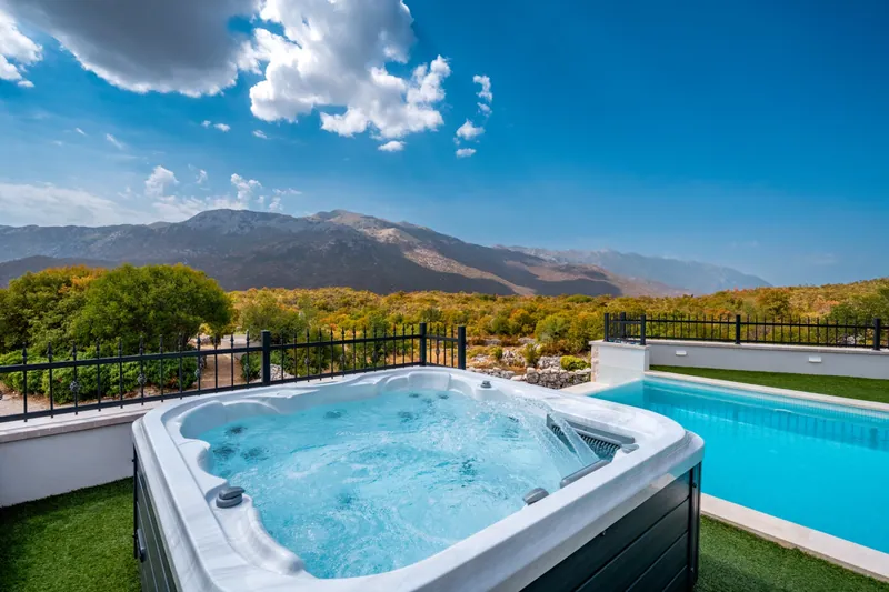 Outdoor Jacuzzi beside the pool