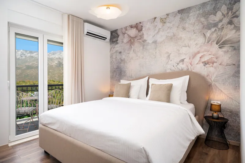 King bedroom with balcony doors