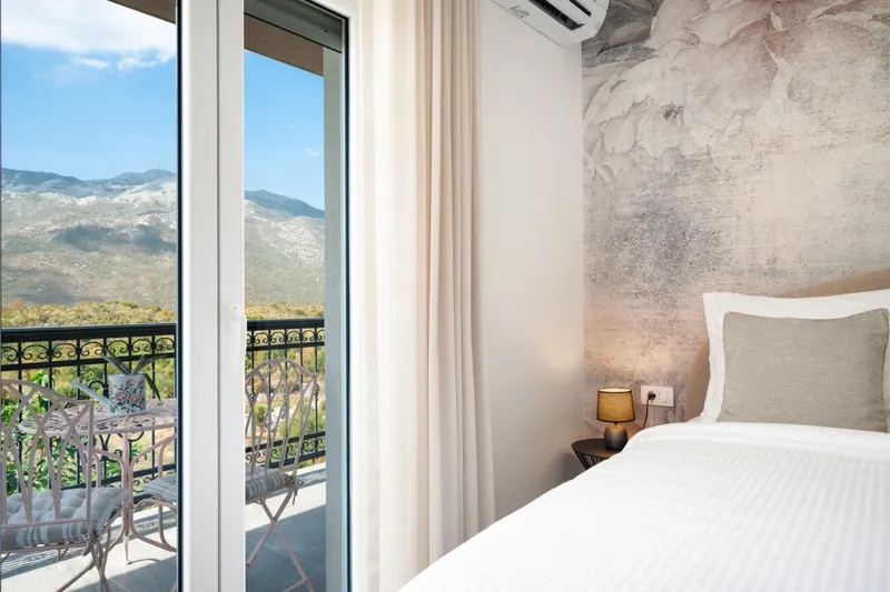 Mountain view through the bedroom balcony doors