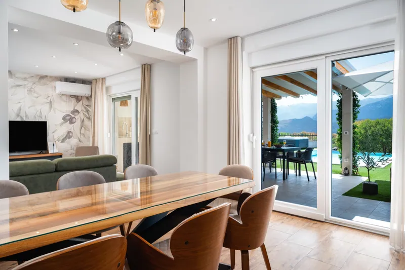 Dining area opening onto the pool terrace