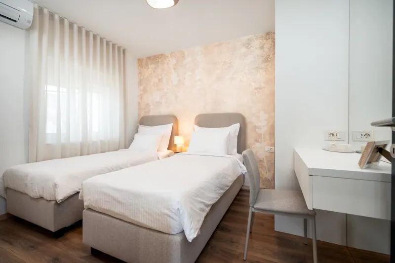 Ground-floor bedroom with two single beds