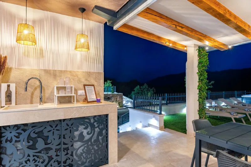 Outdoor kitchen and bar after sunset