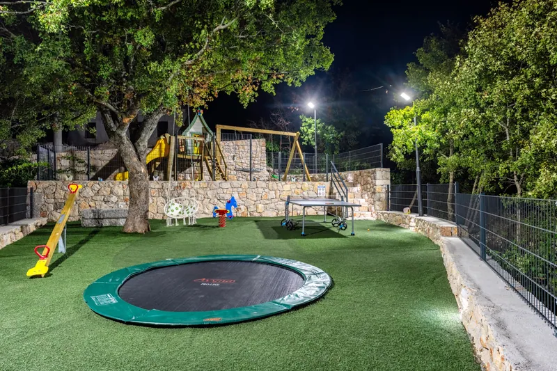 Children’s playground illuminated in the evening