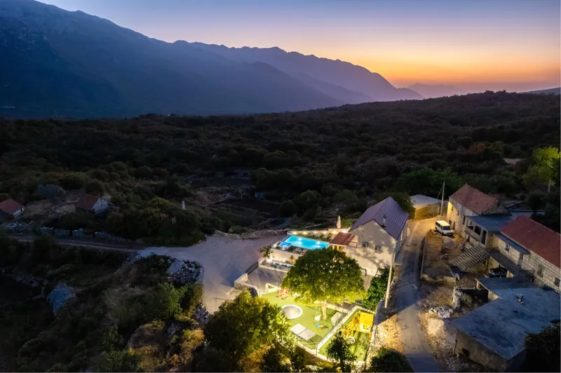 Sunset above the villa and mountain landscape